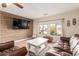 Living room with wood accent wall and leather furniture at 313 W Saddle Mountain Rd, Phoenix, AZ 85086