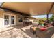 Covered patio with seating area and dining table at 313 W Saddle Mountain Rd, Phoenix, AZ 85086