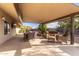 Covered patio with seating area and dining table at 313 W Saddle Mountain Rd, Phoenix, AZ 85086