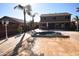 Backyard pool with a large covered pool and lots of lounge space at 31689 N Blackfoot Dr, San Tan Valley, AZ 85143