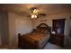 Comfortable bedroom with ceiling fan and closet at 31689 N Blackfoot Dr, San Tan Valley, AZ 85143