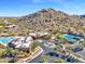 Community clubhouse with pool, tennis courts, and mountain backdrop at 33108 N 72Nd Way, Scottsdale, AZ 85266