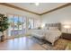 Bright bedroom with king-size bed and access to a private balcony at 33108 N 72Nd Way, Scottsdale, AZ 85266