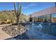 Desert landscape with water feature and seating area at 33108 N 72Nd Way, Scottsdale, AZ 85266