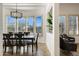 Bright dining area with a table, chairs, and plantation shutters at 33108 N 72Nd Way, Scottsdale, AZ 85266