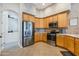 Modern kitchen with stainless steel appliances and wood cabinets at 33108 N 72Nd Way, Scottsdale, AZ 85266