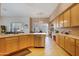 Spacious kitchen with wood cabinets, island, and stainless steel appliances at 33108 N 72Nd Way, Scottsdale, AZ 85266