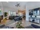 Spacious living room with L-shaped sofa and a fireplace at 33108 N 72Nd Way, Scottsdale, AZ 85266