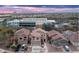 A lovely aerial view of homes near the North Valley Christian Academy with mountain views at sunset at 33610 N 26Th Ave, Phoenix, AZ 85085