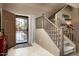 Entryway with staircase, tiled floors, and a view into the living area at 33610 N 26Th Ave, Phoenix, AZ 85085