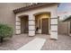 Covered front porch with two chairs and a walkway leading to the front door at 33610 N 26Th Ave, Phoenix, AZ 85085