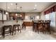 Kitchen with island, stainless steel appliances, and a dining area at 33610 N 26Th Ave, Phoenix, AZ 85085