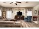 Living area with sectional sofa, recliner, and a view into the kitchen at 33610 N 26Th Ave, Phoenix, AZ 85085