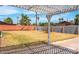 Large backyard with grassy area and lattice at 3426 W Elm St, Phoenix, AZ 85017