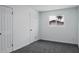 Bedroom with grey carpet and a large window at 3426 W Elm St, Phoenix, AZ 85017