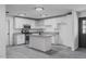 Modern kitchen with white cabinets and a kitchen island at 3426 W Elm St, Phoenix, AZ 85017