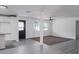 Bright and airy living room with grey carpet and large windows at 3426 W Elm St, Phoenix, AZ 85017