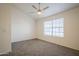 Spacious bedroom with large window and ceiling fan at 3491 N Arizona Ave # 54, Chandler, AZ 85225