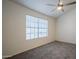 Spacious bedroom with large window and ceiling fan at 3491 N Arizona Ave # 54, Chandler, AZ 85225