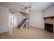 Living room with fireplace, ceiling fan, and tiled floors at 3491 N Arizona Ave # 54, Chandler, AZ 85225