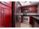 Stainless steel appliances and dark wood cabinets at 3535 W Tierra Buena Ln # 156, Phoenix, AZ 85053