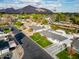 Aerial view of single-story home with spacious backyard, landscape, and mountain backdrop at 3601 N 48Th Way, Phoenix, AZ 85018