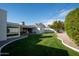 Landscaped backyard with a grassy lawn, providing ample outdoor space at 3601 N 48Th Way, Phoenix, AZ 85018