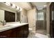 Bathroom with double vanity, walk-in shower, and modern fixtures at 3601 N 48Th Way, Phoenix, AZ 85018