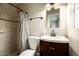 Clean bathroom with a shower/tub combo and vanity at 3601 N 48Th Way, Phoenix, AZ 85018