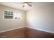 Bright bedroom with hardwood floors and a ceiling fan at 3601 N 48Th Way, Phoenix, AZ 85018