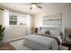 Spacious bedroom with a comfortable bed and large window at 3601 N 48Th Way, Phoenix, AZ 85018