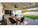 Covered patio features a dining table and chairs, providing an outdoor entertaining space at 3601 N 48Th Way, Phoenix, AZ 85018