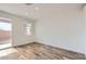 Bedroom with tile floors and sliding glass door to patio at 36530 W Leonessa Ave, Maricopa, AZ 85138