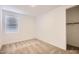 Bright bedroom with neutral carpeting and window blinds at 36530 W Leonessa Ave, Maricopa, AZ 85138