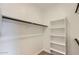 Spacious walk-in closet with shelving and hanging rod at 36530 W Leonessa Ave, Maricopa, AZ 85138