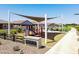 Harvester Park playground with shade structures at 36530 W Leonessa Ave, Maricopa, AZ 85138