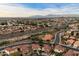 Aerial view of a suburban neighborhood with mountains in the background at 3720 E South Fork Dr, Phoenix, AZ 85044