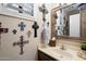 Small bathroom with a pedestal sink and many crosses at 3720 E South Fork Dr, Phoenix, AZ 85044