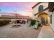 Peaceful brick courtyard with seating area, perfect for relaxing evenings at 3720 E South Fork Dr, Phoenix, AZ 85044