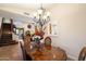 Elegant dining room with a formal table and chandelier at 3720 E South Fork Dr, Phoenix, AZ 85044