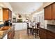 Bright kitchen with granite counters, copper sink, and breakfast nook at 3720 E South Fork Dr, Phoenix, AZ 85044