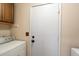 Bright laundry room with washer, dryer, and ample storage at 3720 E South Fork Dr, Phoenix, AZ 85044