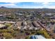 An aerial view of the community near shops and a mountain range at 37222 N Tom Darlington Dr # 2, Carefree, AZ 85377