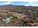 Complex near shops and mountains with a pool and desert landscape at 37222 N Tom Darlington Dr # 2, Carefree, AZ 85377