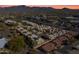 Aerial view of a community with a pool and desert landscape at 37222 N Tom Darlington Dr # 2, Carefree, AZ 85377