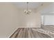 Spacious dining area featuring a modern chandelier and wood-look flooring at 37222 N Tom Darlington Dr # 2, Carefree, AZ 85377