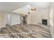 Spacious living room with fireplace and wood-look floors at 37222 N Tom Darlington Dr # 2, Carefree, AZ 85377