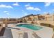 Community pool with lounge chairs and mountain views at 37222 N Tom Darlington Dr # 2, Carefree, AZ 85377