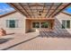 Brick paver patio and pergola with ceiling fan at 42521 W Sea Eagle Dr, Maricopa, AZ 85138