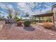 Landscaped backyard with gravel and stone pathway at 42521 W Sea Eagle Dr, Maricopa, AZ 85138